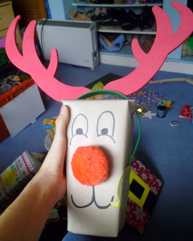 Little box? Turn it into a reindeer head of course! A massive red pompom is all you really need to give this fella a personality